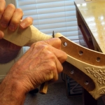 bob-continues-carving-on-45th-anniv-cremona-headstock-4-24-11