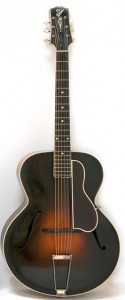 black and brown acoustic archtop guitar